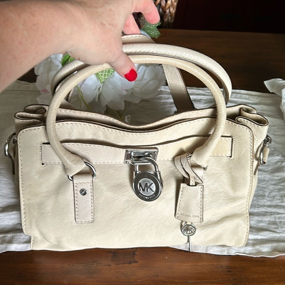Michael Kors handbag silver lock and keys tan color impeccable
